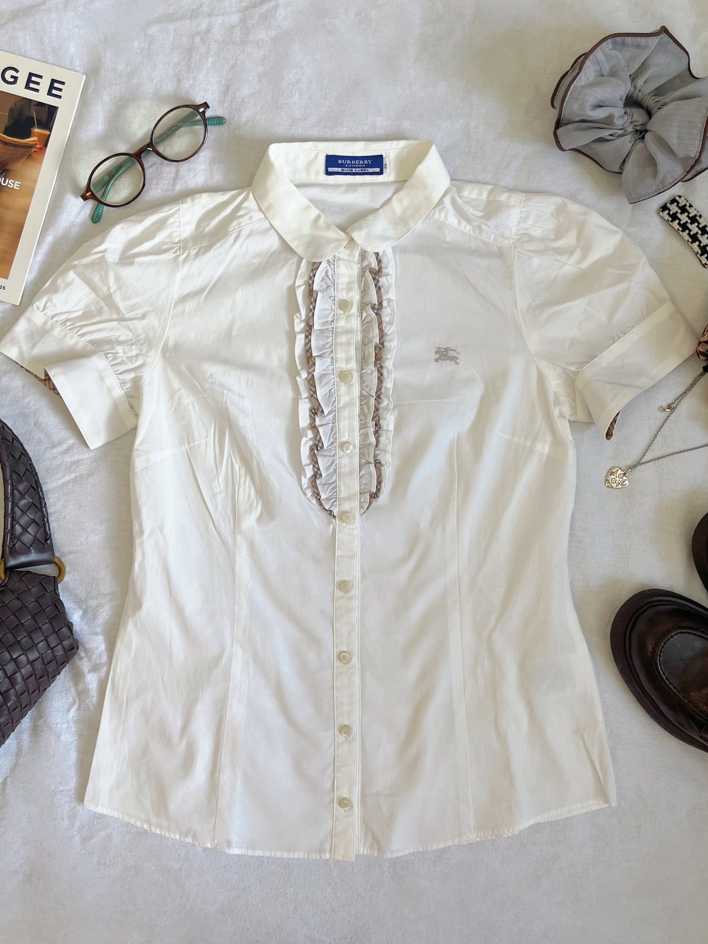 White Burberry ruffle shirt with a touch of preppy charm