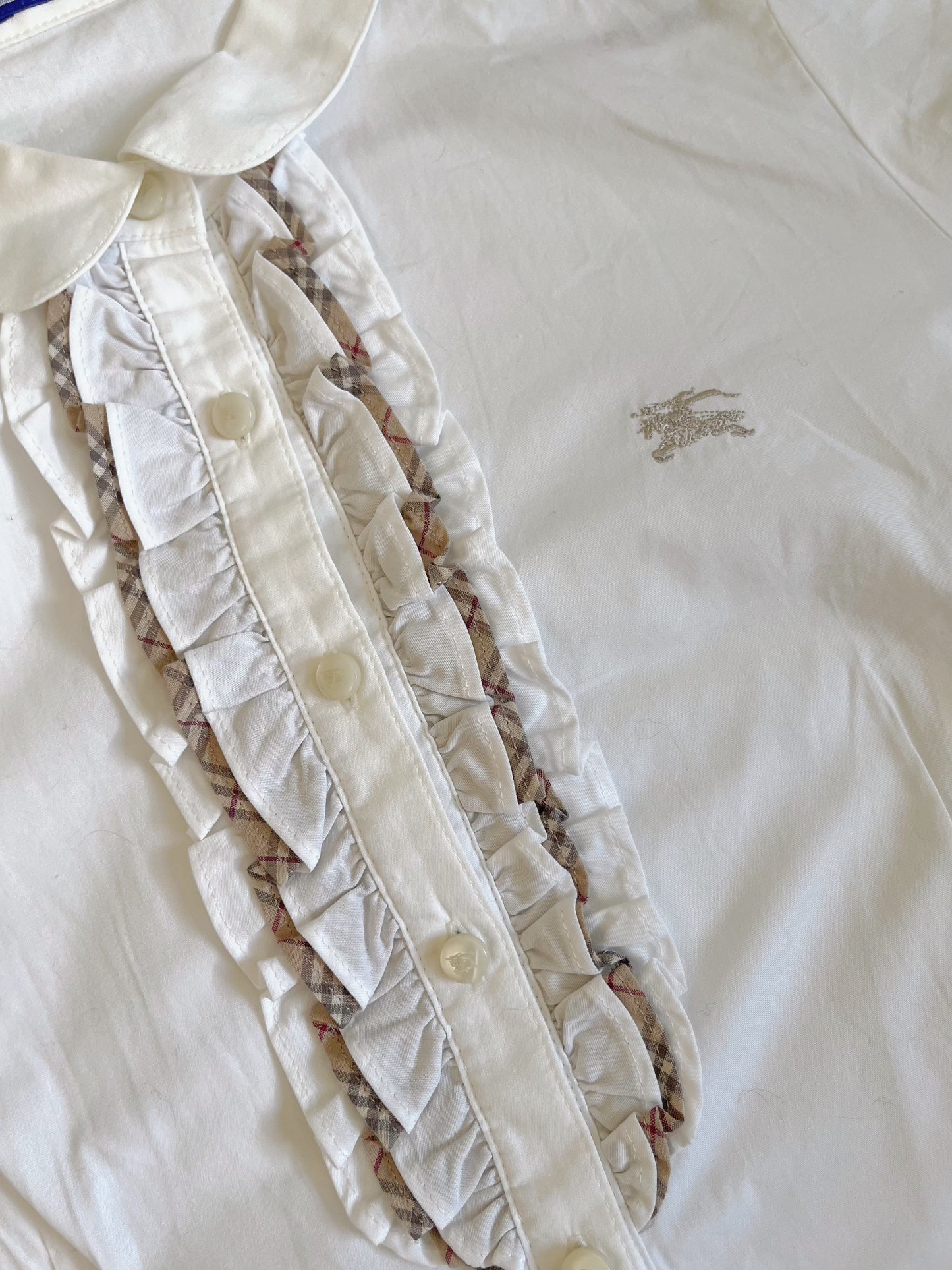 White Burberry ruffle shirt with a touch of preppy charm