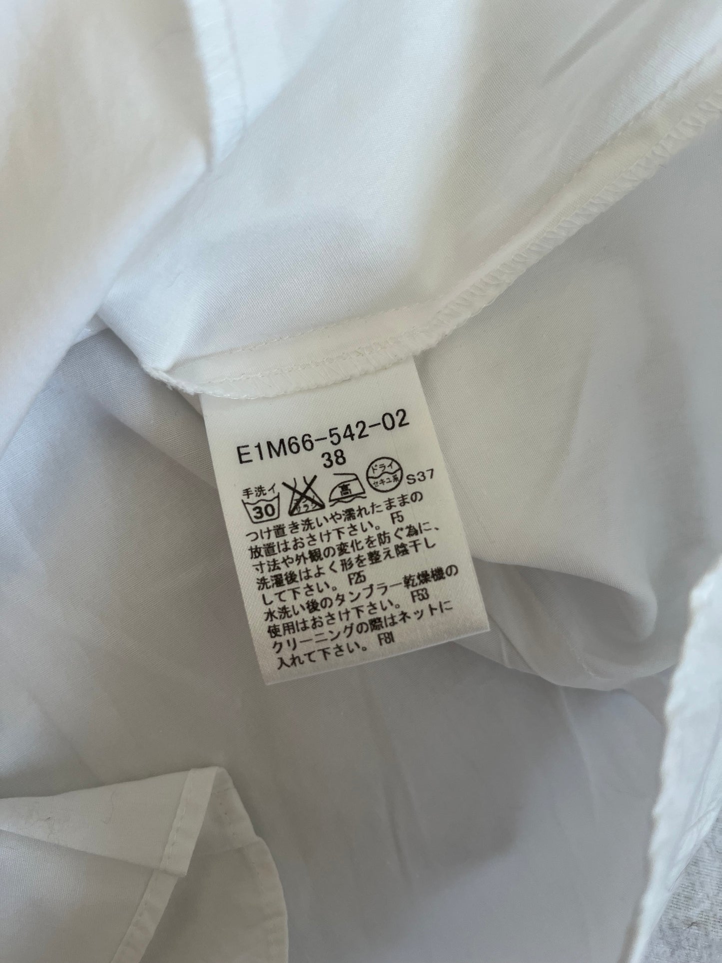White Burberry ruffle shirt with a touch of preppy charm