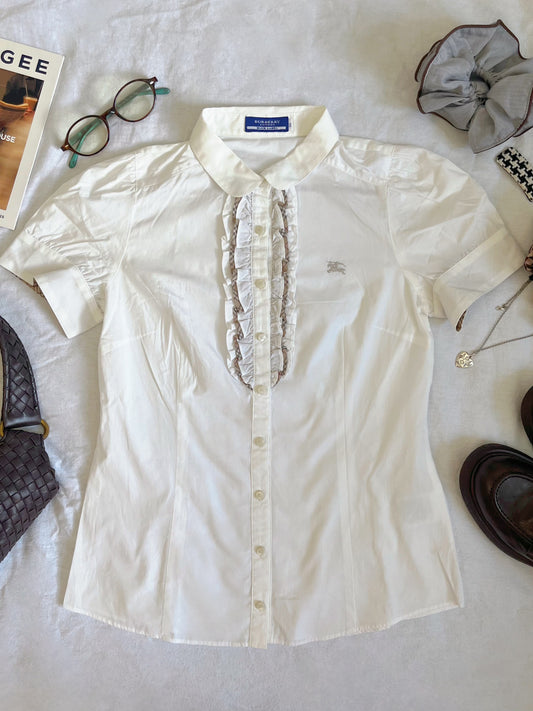 White Burberry ruffle shirt with a touch of preppy charm