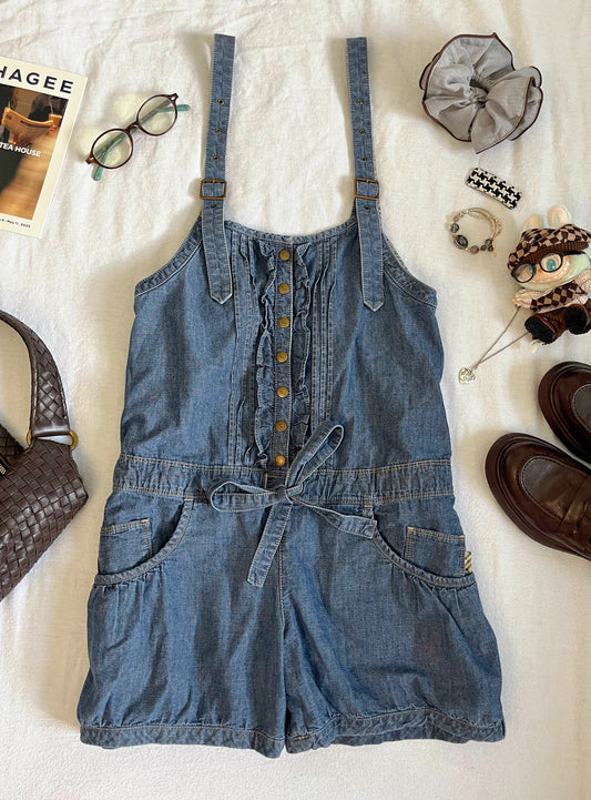 Blue denim romper with ruffles and frills